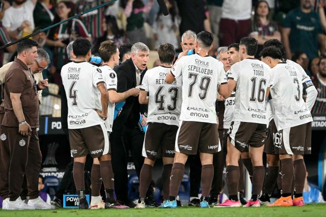 (FILES) Platense's head coach Martin Palermo gives instructions to his players during the Copa Libertadores quarter-final first leg football match between Brazil's Fluminense and Argentina's Platense at the Maracana stadium in Rio de Janeiro, Brazil on September 8, 2026. Martin Palermo, the iconic Argentine forward known for his dramatic comebacks and unforgettable feats in the Copa Libertadores, is now as head coach looking to infuse Platense with his cup aura to stage a comeback against Fluminense in Argentina on September 15, 2026, in order to advance to the semifinals. (Photo by MAURO PIMENTEL / AFP)