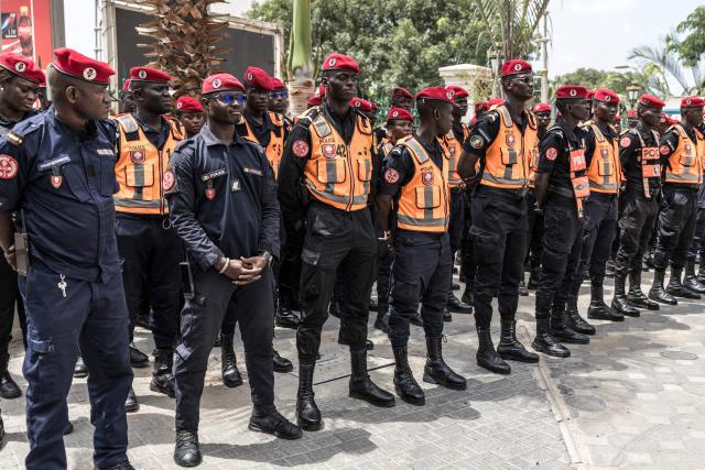 Senegalese police officers stand in formation ahead of the ceremony marking the start of the Youth Olympic Flame's 46-day tour in Dakar, on September 14, 2026. The Youth Olympic Flame will travel across Senegal's 14 regions before returning to Dakar for the opening ceremony on October 31, 2026. Senegal will host the Summer Youth Olympic Games from October 31 to November 13, 2026, bringing together 2,700 athletes competing in 25 sports. (Photo by PATRICK MEINHARDT / AFP)