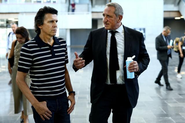Olympic Games Executive Director Christophe Dubi (L) talks to CEO of GL Events Olivier Ferraton on the sidelines of a visit by members of the International Olympic Committee (IOC) Coordination Commission in Chassieu, outside Lyon on September 14, 2026. (Photo by Alex MARTIN / AFP)