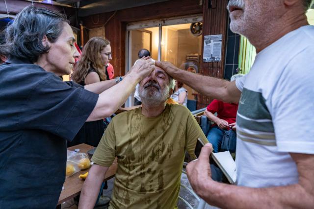 People help a protester suffering from the effects of tear gas during a demonstration against the arrests of LGBTQ activists in Izmir, on September 14, 2026. Turkish police fired tear gas at demonstrators in the western city of Izmir on September 14, 2026 as they protested against the growing targeting of LGBTQ activists, an AFP photographer reported. The rally came a day after police carried out sweeping nationwide raids, arresting dozens of people in a campaign the government said was aimed at promoting traditional family values. (Photo by Murat Kocabas / AFP)