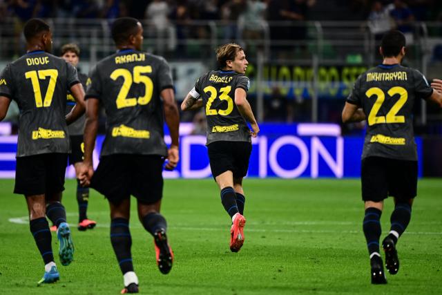 Inter Milan's Italian midfielder #23 Nicolo Barella celebrates after scoring his team second goal during the Italian Serie A football match between Inter Milan and Udinese at the San Siro Stadium in Milan, Italy on September 14, 2026. (Photo by Piero CRUCIATTI / AFP)