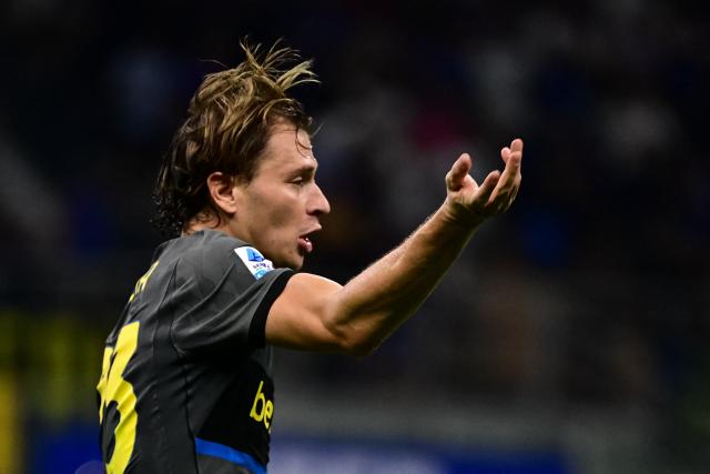 Inter Milan's Italian midfielder #23 Nicolo Barella celebrates after scoring his team second goal during the Italian Serie A football match between Inter Milan and Udinese at the San Siro Stadium in Milan, Italy on September 14, 2026. (Photo by Piero CRUCIATTI / AFP)