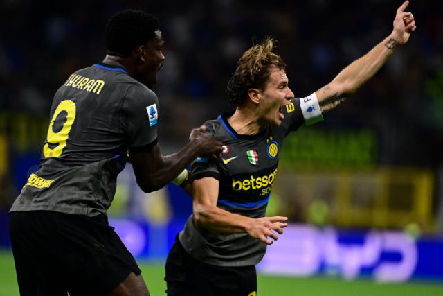 Inter Milan's Italian midfielder #23 Nicolo Barella celebrates after scoring his team second goal during the Italian Serie A football match between Inter Milan and Udinese at the San Siro Stadium in Milan, Italy on September 14, 2026. (Photo by Piero CRUCIATTI / AFP)