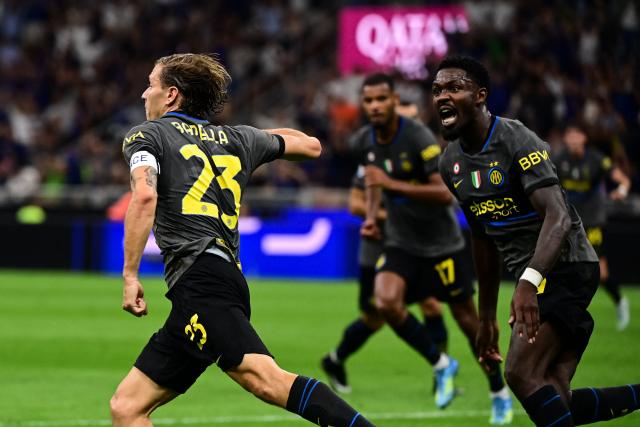 Inter Milan's Italian midfielder #23 Nicolo Barella celebrates after scoring his team second goal during the Italian Serie A football match between Inter Milan and Udinese at the San Siro Stadium in Milan, Italy on September 14, 2026. (Photo by Piero CRUCIATTI / AFP)