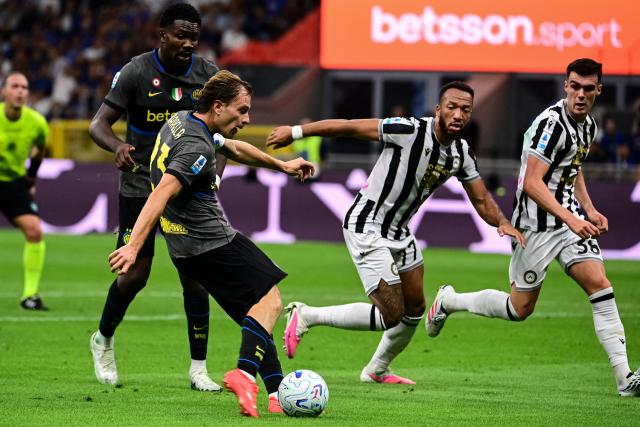 Inter Milan's Italian midfielder #23 Nicolo Barella scores his team second goal during the Italian Serie A football match between Inter Milan and Udinese at the San Siro Stadium in Milan, Italy on September 14, 2026. (Photo by Piero CRUCIATTI / AFP)
