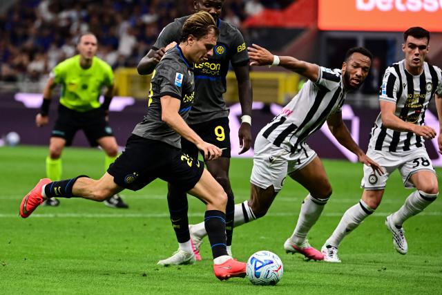 Inter Milan's Italian midfielder #23 Nicolo Barella scores his team second goal during the Italian Serie A football match between Inter Milan and Udinese at the San Siro Stadium in Milan, Italy on September 14, 2026. (Photo by Piero CRUCIATTI / AFP)