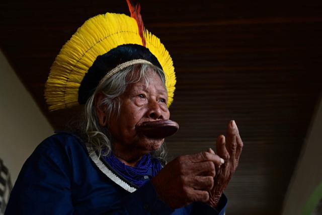 (FILES) Brazilian Indigenous leader of the Kayapo people Raoni Metuktire gives an AFP interview at Raoni Institute in Peixoto de Azevedo in Mato Grosso state, Brazil on March 19, 2025. Raoni Metuktire, who became the most recognized face of the fight to save the Amazon rainforest, is suffering from digestive tract cancer and receiving palliative care at home, his institute reported on September 14, 2026, two months after a long hospitalization. (Photo by Pablo PORCIUNCULA / AFP)
