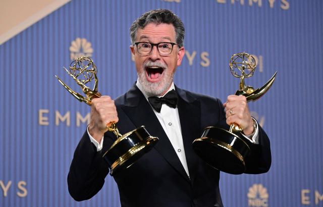 US comedian and writer Stephen Colbert winner of Outstanding Variety Series for "The Late Show with Stephen Colbert" and Outstanding Short Form Comedy, Drama or Variety Series for The Late Show digital/online program "Colbert Before Air" pose in the press room during the 78th Primetime Emmy Awards at the Peacock Theatre at LA Live in Los Angeles on September 14, 2026. (Photo by Frederic J. Brown / AFP)