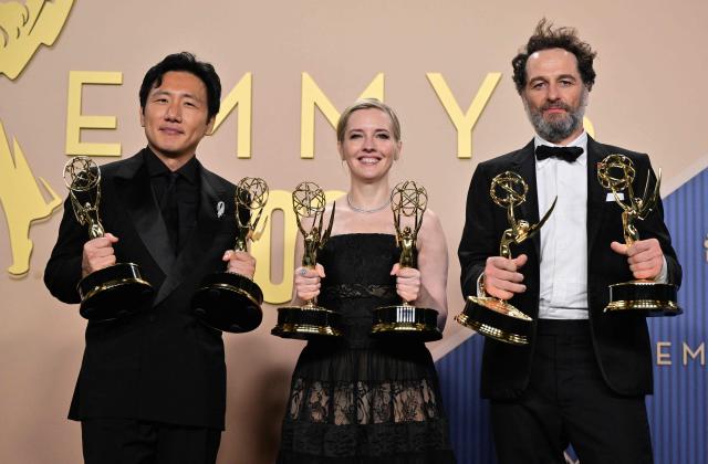 (From L) Japanese-US filmmaker Hiro Murai winner of the award for Outstanding Directing for a Comedy Seriesfor "Welcome to Widow's Bay" episode from "Widow's Bay", US screenwriter Katie Dippold winner of Outstanding Writing for a Comedy Series for "Widow's Bay" and Welsh actor Matthew Rhys winner of the awards for Outstanding Lead Actor in a Comedy Series for "Widow's Bay" pose in the press room during the 78th Primetime Emmy Awards at the Peacock Theatre at LA Live in Los Angeles on September 14, 2026. (Photo by Frederic J. Brown / AFP)