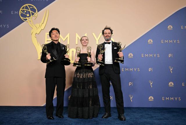 (From L) Japanese-US filmmaker Hiro Murai winner of the award for Outstanding Directing for a Comedy Seriesfor "Welcome to Widow's Bay" episode from "Widow's Bay", US screenwriter Katie Dippold winner of Outstanding Writing for a Comedy Series for "Widow's Bay" and Welsh actor Matthew Rhys winner of the awards for Outstanding Lead Actor in a Comedy Series for "Widow's Bay" and Outstanding Lead Actor in a Limited or Anthology Series or Movie for "The Beast in Me" pose in the press room during the 78th Primetime Emmy Awards at the Peacock Theatre at LA Live in Los Angeles on September 14, 2026. (Photo by Frederic J. Brown / AFP)