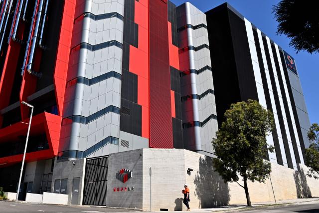 A person walks outside Australian data centre operator NextDC's Artarmon facility in Sydney on September 15, 2026. (Photo by Saeed KHAN / AFP)