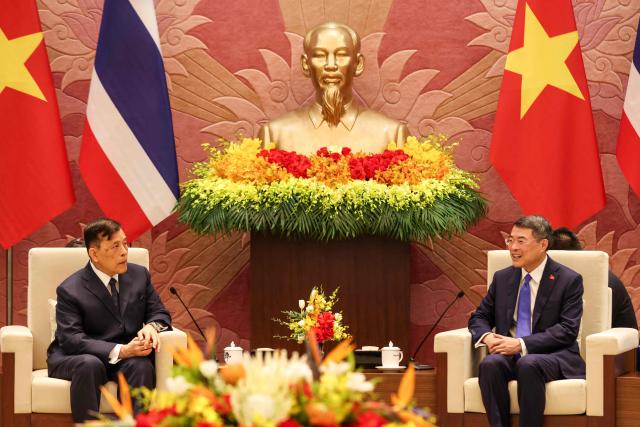 Vietnam’s Prime Minister Le Minh Hung (R) speaks to Thailand's King Maha Vajiralongkorn (L) at the National Assembly in Hanoi on September 15, 2026. (Photo by LUONG THAI LINH / POOL / AFP)