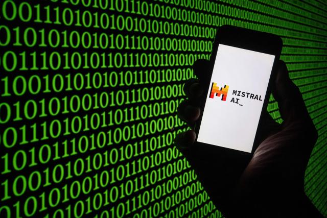 (FILES) This picture taken on March 25, 2024, shows the Mistral Ai logo on a smartphone in Mulhouse, eastern France. French oil and gas giant TotalEnergies announced on September 15, 2026 a three-year partnership with French artificial intelligence company Mistral, representing an investment of more than 100 million euros. The aim of this partnership is to “develop a new generation of frontier models in artificial intelligence to support TotalEnergies’ geoscience experts in the exploration, characterization and development of oil and gas reservoirs,” TotalEnergies said in a press release. (Photo by SEBASTIEN BOZON / AFP)
