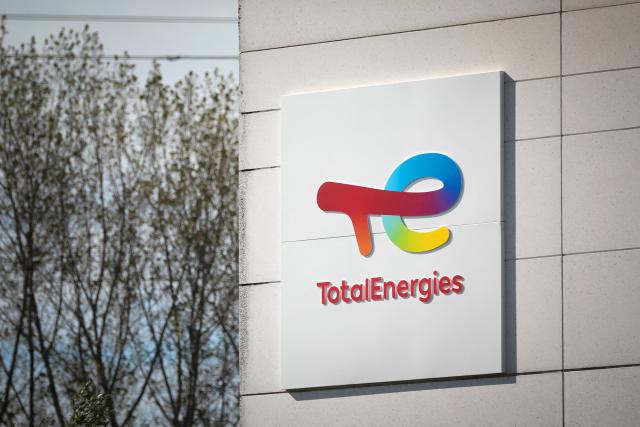 (FILES) A photograph shows the logo of TotalEnergies at the Total Energies refinery site, in Gonfreville-l'Orcher, near Le Havre, northwestern France, on October 5, 2022. French oil and gas giant TotalEnergies announced on September 15, 2026 a three-year partnership with French artificial intelligence company Mistral, representing an investment of more than 100 million euros. The aim of this partnership is to “develop a new generation of frontier models in artificial intelligence to support TotalEnergies’ geoscience experts in the exploration, characterization and development of oil and gas reservoirs,” TotalEnergies said in a press release. (Photo by Lou BENOIST / AFP)