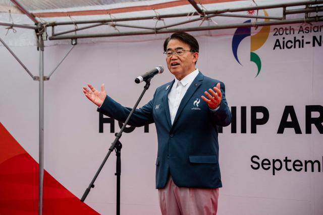 Aichi Prefecture Governor and Aichi-Nagoya Asian Games Organising Committee President Hideaki Omura delivers a speech during a ceremony marking the arrival of the Costa Serena cruise ship at the Port of Nagoya in Nagoya, Aichi prefecture on September 15, 2026. (Photo by Fred Mery / AFP)