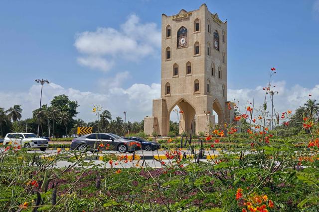 Vehicles drive past the Burj al-Nahda roundabout in Oman's port city of Salalah on September 14, 2026. (Photo by AFP)