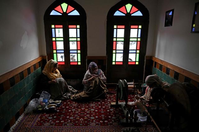 Kashmiri artisans work on embroideries during an exhibition in Srinagar on September 15, 2026. (Photo by TAUSEEF MUSTAFA / AFP)