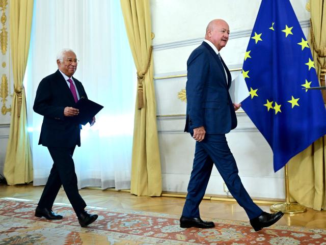 President of the European Council Antonio Costa (L) and Austria's Chancellor Christian Stocker arrive for a press conference after a meeting in Vienna, on September 15, 2026. (Photo by ROLAND SCHLAGER / APA / AFP) / Austria OUT