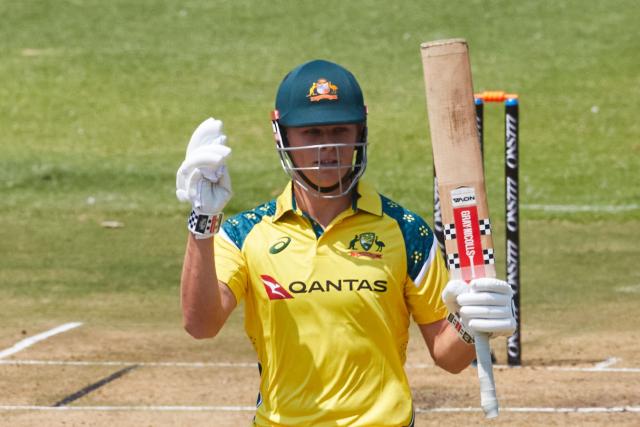 Australia's Cooper Connolly raises his bat on reaching 50 runs during the first One Day International series played between hosts Zimbabwe and  Australia at Harare Sports Club on September 15, 2026 in Harare. (Photo by Jekesai NJIKIZANA / AFP)