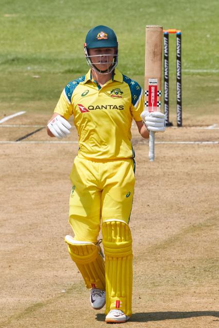 Australia's Cooper Connolly raises his bat on reaching 50 runs during the first One Day International series played between hosts Zimbabwe and  Australia at Harare Sports Club on September 15, 2026 in Harare. (Photo by Jekesai NJIKIZANA / AFP)