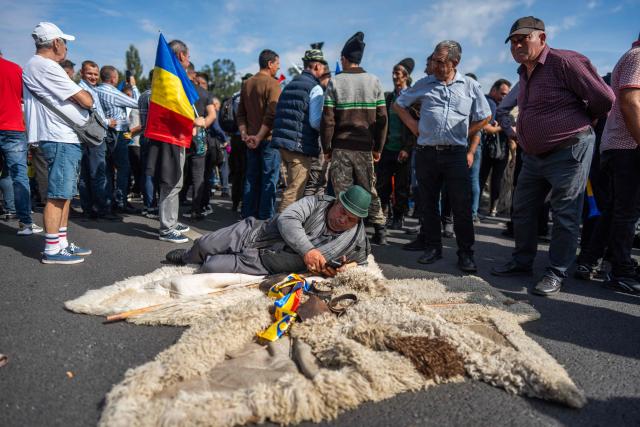 Shepherds take part in a protest in Bucharest, Romania, September 15, 2026. Some 2.000 people protested in front of the Romanian government in the capital Bucharest, a protest started by disgruntled farmers and shepherds, which was also promoted online by supporters of the far right. Several participants jostled one another and came to blows with law enforcement, which used tear gas. The shepherds call for the lifting of the ban on live sheep exports in the EU, a measure imposed after the livestock sector was affected by small ruminant plague. (Photo by Mihai Barbu / AFP)