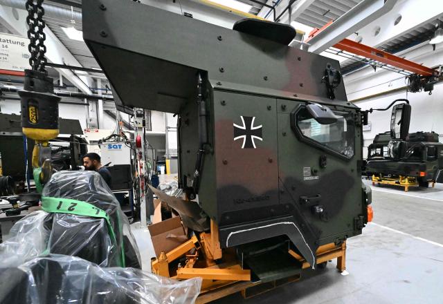 An employee works at a military vehicle during a visit of the Austrian Chancellor at the Rheinmetall MAN Military Vehicles (RMMV) plant in Vienna-Liesing, Austria, on September 15, 2026. (Photo by Joe Klamar / AFP)