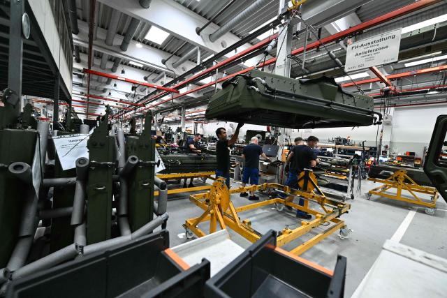 Employee works at a production line of military vehicles during a visit of the Austrian Chancellor at the Rheinmetall MAN Military Vehicles (RMMV) plant in Vienna-Liesing, Austria, on September 15, 2026. (Photo by Joe Klamar / AFP)