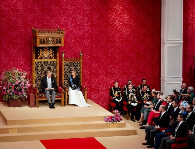 Dutch King Willem-Alexander, next to Queen Maxima (R), delivers a speech to members of the Senate and the House of Representatives during the Prinsjesdag in The Hague on September 15, 2026. (Photo by Robin van Lonkhuijsen / ANP / AFP) / Netherlands OUT