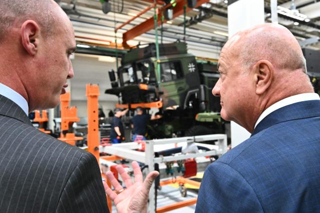 Austrian Chancellor Christian Stocker (R) listens to CEO and Chairman of the Management Board of Rheinmetall MAN Military Vehicles (RMMV) Christoph Mueller during a visit at the Rheinmetall MAN Military Vehicles (RMMV) plant in Vienna-Liesing, Austria, on September 15, 2026. The Rheinmetall MAN Military Vehicles (RMMV) plant in Vienna is the biggest manufacturer of military vehicles in Europe. (Photo by Joe Klamar / AFP)