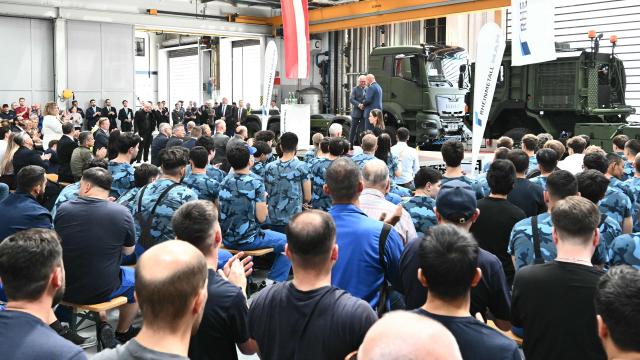 Austrian Chancellor Christian Stocker (R) and the CEO of German arms manufacturer Rheinmetall Armin Papperger shake hands during a visit at the Rheinmetall MAN Military Vehicles (RMMV) plant in Vienna-Liesing, Austria, on September 15, 2026. The Rheinmetall MAN Military Vehicles (RMMV) plant in Vienna is the biggest manufacturer of military vehicles in Europe. (Photo by Joe Klamar / AFP)