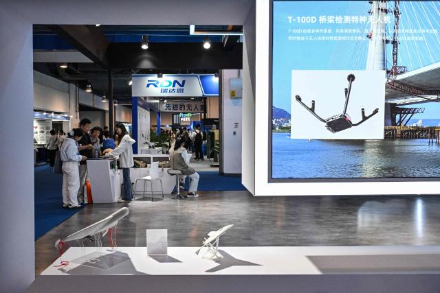 People visit the 14th China International Defence Electronics Exhibition (CIDEX) in Beijing on September 15, 2026. (Photo by ADEK BERRY / AFP)