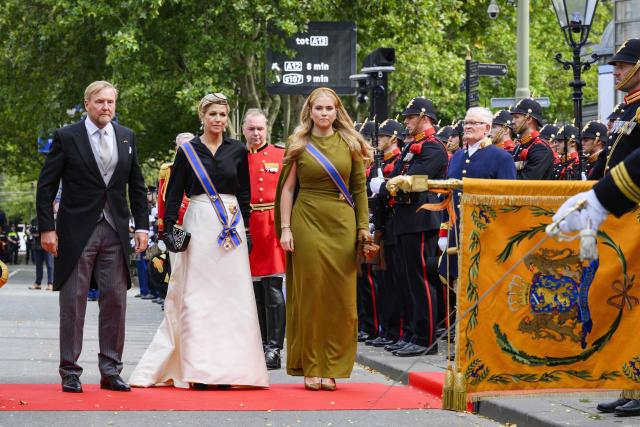 (LtoR) King Willem-Alexander, Queen Maxima and Princess Amalia salute the royal standard upon arrival at the Royal Theatre for the Speech from the Throne, which opens the new working year of the First and Second Chambers, during Budget Day (Prinsjesdag) in The Hague on September 15, 2026. (Photo by Patrick van Emst / ANP / AFP) / Netherlands OUT