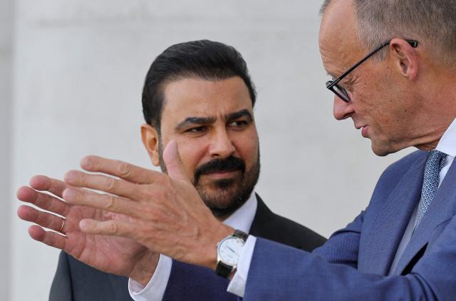 German Chancellor Friedrich Merz (R) talks with Iraq's Prime Minister Ali Falih Kadhim al-Zaidi during a visit at the Chancellery in Berlin on September 15, 2026. (Photo by Fabrizio Bensch / POOL / AFP)
