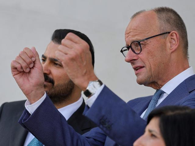 German Chancellor Friedrich Merz (R) talks with Iraq's Prime Minister Ali Falih Kadhim al-Zaidi during a visit at the Chancellery in Berlin on September 15, 2026. (Photo by Fabrizio Bensch / POOL / AFP)