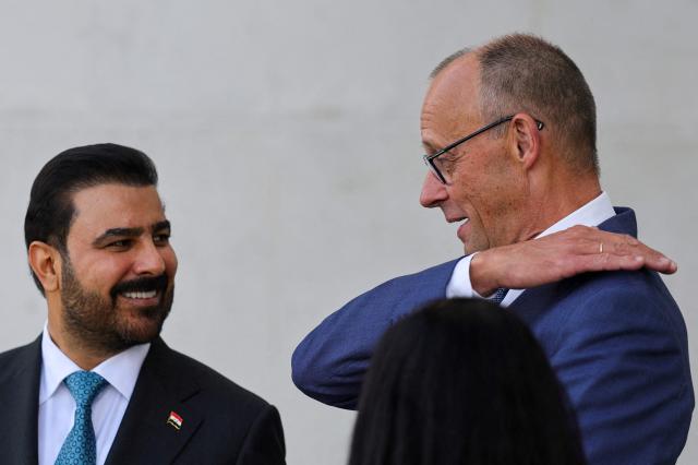 German Chancellor Friedrich Merz (R) talks with Iraq's Prime Minister Ali Falih Kadhim al-Zaidi during a visit at the Chancellery in Berlin on September 15, 2026. (Photo by Fabrizio Bensch / POOL / AFP)