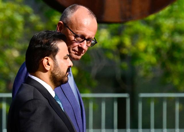 German Chancellor Friedrich Merz (R) and Iraq's Prime Minister Ali al-Zaidi attend a welcoming ceremony on September 15, 2026 at the Chancellery in Berlin prior talks. (Photo by John MACDOUGALL / AFP)