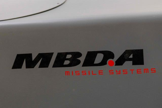 This photograph shows the MBDA logo at the MBDA multinational group plant, a corporation that designs and manufactures missiles and weapons in Selles-Saint-Denis on September 15, 2026. On September 15, 2026, the European missile manufacturer MBDA confirmed to AFP its plan to set up a new production site near Orléans, intended to support the sharp ramp-up in its missile production and which could eventually employ 400 people. (Photo by Alain JOCARD / AFP)