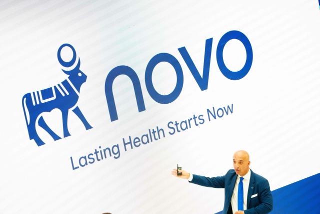 The CEO of Novo Mike Doustdar speaks during an employees' event in Bagsvaerd, Denmark, on September 15, 2026. Novo Nordisk introduces a new logo, new slogan, and a new employee philosophy. It's about keeping up with the times and addressing a new customer group more clearly. The company name Novo Nordisk has been reduced to Novo. The logo with the Apis bull - borrowed from Egyptian mythology - has been reversed, so the bull now looks to the right instead of the left. And the company's slogan will henceforth be "Lasting health starts now". (Photo by Mads Claus Rasmussen / Ritzau Scanpix / AFP) / Denmark OUT