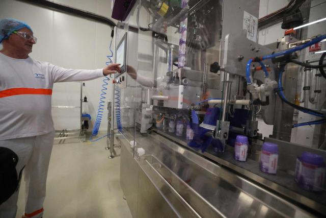 A Danone employee works on the production lines at the company's plant in Steenvoorde on the inauguration day of Danone's largest medical nutrition line in France, on September 15, 2026. (Photo by Francois LO PRESTI / AFP)