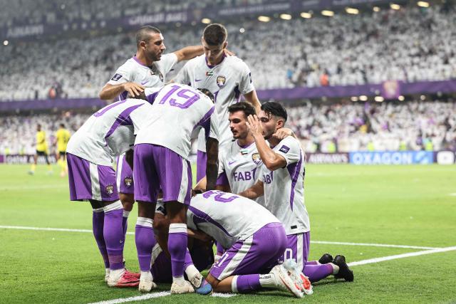 Ain's players celebrate after Moroccan forward #13 Houssine Rahimi scored the team's first goal during the AFC Champions League Elite (ACL) football match between Al-Ain and Al-Nassr at the Azza Bin Zayed stadium in Al-Ain on September 15, 2026. (Photo by Fadel SENNA / AFP)