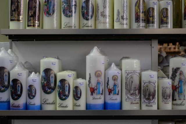 This photograph shows candles displayed for sale at a shop in Lourdes on September 15, 2026. Pope Leo XIV will travel to Lourdes, a site of pilgrimage for Christians worldwide, where he will hold an open-air mass on Sunday, September 27, before presiding over another at the cathedral in the northeastern city of Metz on September 28. (Photo by Ed JONES / AFP)