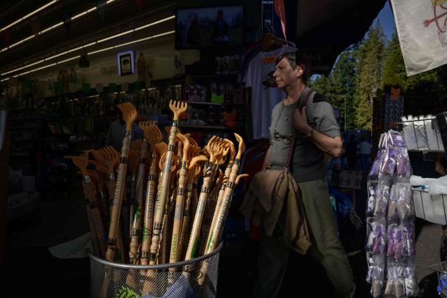 This photograph shows souvenirs displayed in a shop in Lourdes on September 15, 2026. Pope Leo XIV will travel to Lourdes, a site of pilgrimage for Christians worldwide, where he will hold an open-air mass on Sunday, September 27, before presiding over another at the cathedral in the northeastern city of Metz on September 28. (Photo by Ed JONES / AFP)