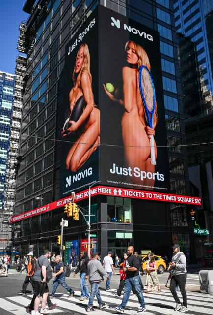 US actress Sydney Sweeney appears in an advertising campaign for sports betting app Novig on a billboard in Times Square in New York City on September 15, 2026. Actor Sydney Sweeney has been condemned by leading women athletes for a sports betting advert in which the American appears in various states of undress. (Photo by ANGELA WEISS / AFP)