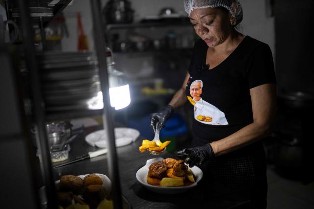 Ruth Garcia cooks a Chiclayo-style dish called "Frito Chiclayano," said to have been one of Pope Leo XIV's favorite dishes, at her restaurant in Lima on September 15, 2026. Pope Leo XIV will visit Uruguay, Argentina and Peru from November 6 to 17, the Vatican said on August 5, in a return to the continent where the pontiff spent decades as a missionary. (Photo by Ernesto BENAVIDES / AFP)