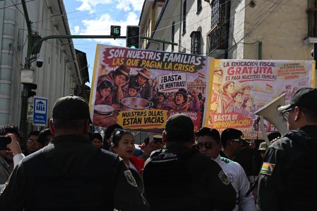 Education workers take part in a protest banging pots against the Bolivian government in La Paz on September 15, 2026. (Photo by Aizar RALDES / AFP)