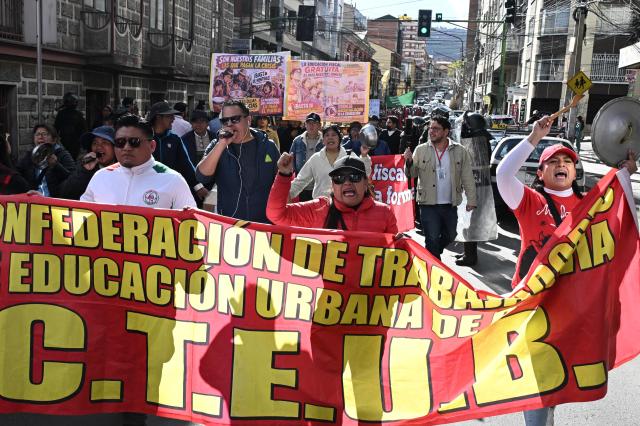 Education workers take part in a protest banging pots against the Bolivian government in La Paz on September 15, 2026. (Photo by Aizar RALDES / AFP)