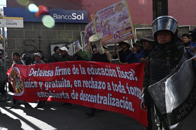 Education workers take part in a protest banging pots against the Bolivian government in La Paz on September 15, 2026. (Photo by Aizar RALDES / AFP)