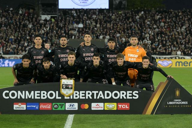 Platense players pose for a team photo ahead of the Copa Libertadores quarter-final second leg football match between Argentina's Platense and Brazil's Fluminense at the Ciudad de Vicente Lopez stadium in Vicente Lopez, Buenos Aires province, Argentina on September 15, 2026. (Photo by JUAN MABROMATA / AFP)