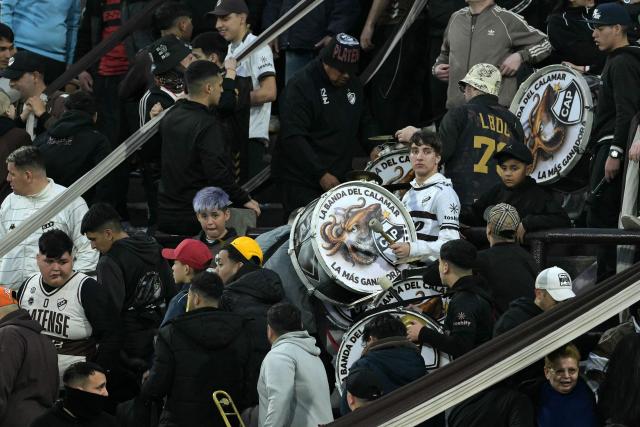 Platense fans gather with drums ahead of the Copa Libertadores quarter-final second leg football match between Argentina's Platense and Brazil's Fluminense at the Ciudad de Vicente Lopez stadium in Vicente Lopez, Buenos Aires province, Argentina on September 15, 2026. (Photo by JUAN MABROMATA / AFP)