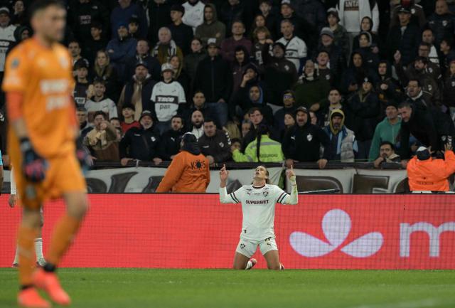 Fluminense's Uruguayan midfielder #17 Agustin Canobbio celebrates after scoring during the Copa Libertadores quarter-final second leg football match between Argentina's Platense and Brazil's Fluminense at the Ciudad de Vicente Lopez stadium in Vicente Lopez, Buenos Aires province, Argentina on September 15, 2026. (Photo by JUAN MABROMATA / AFP)